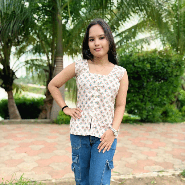 rayon printed sleeveless kurti with front slit – soft peach & multicolor motif