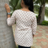 printed rayon v neck kurti with 3/4 sleeves – soft peach ethnic motif